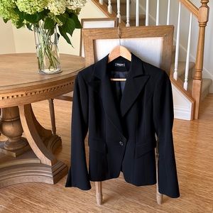 Parison black wool jacket. Has a flared sleeve with slits at the cuff.